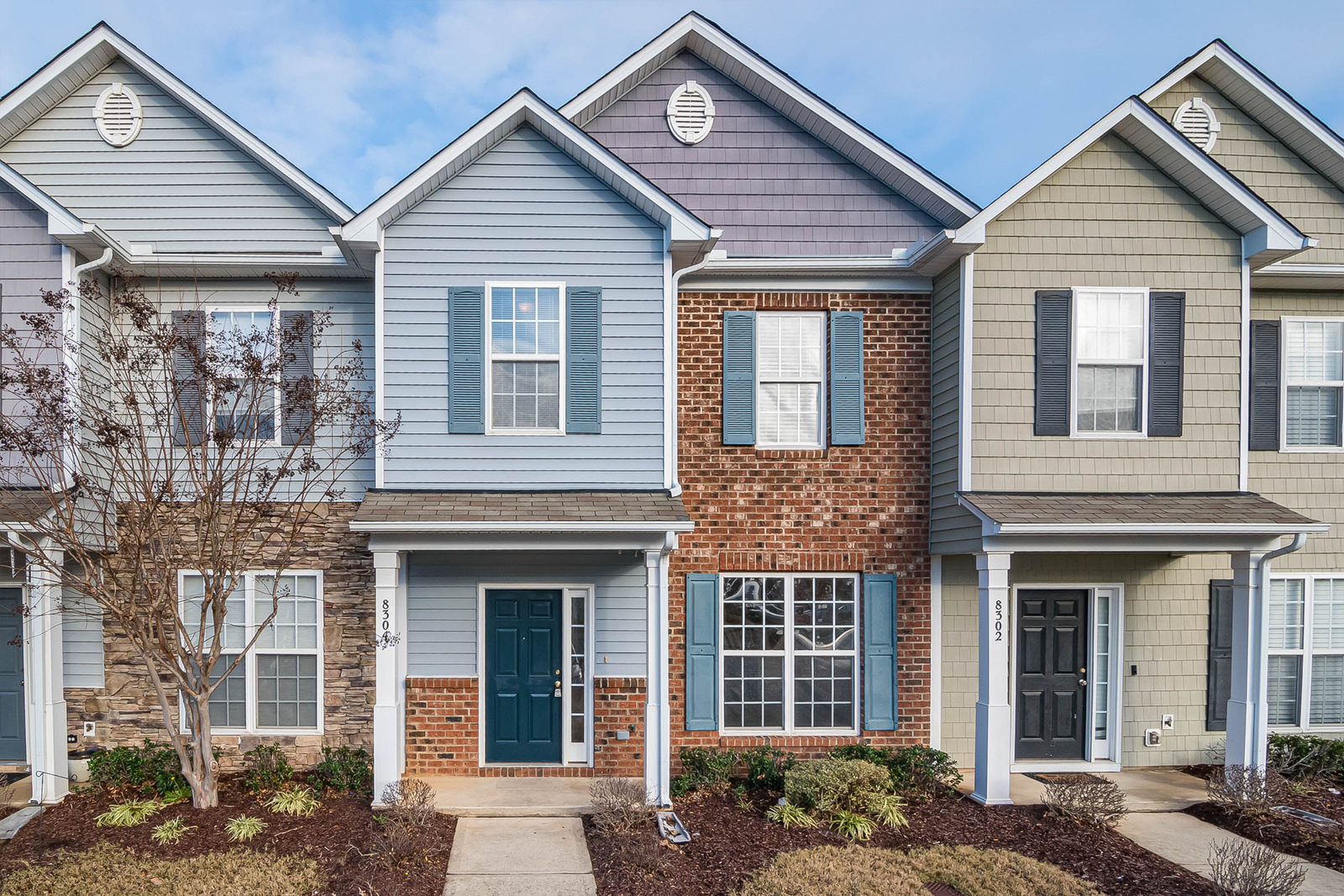 A row of classic townhouses on a residential street