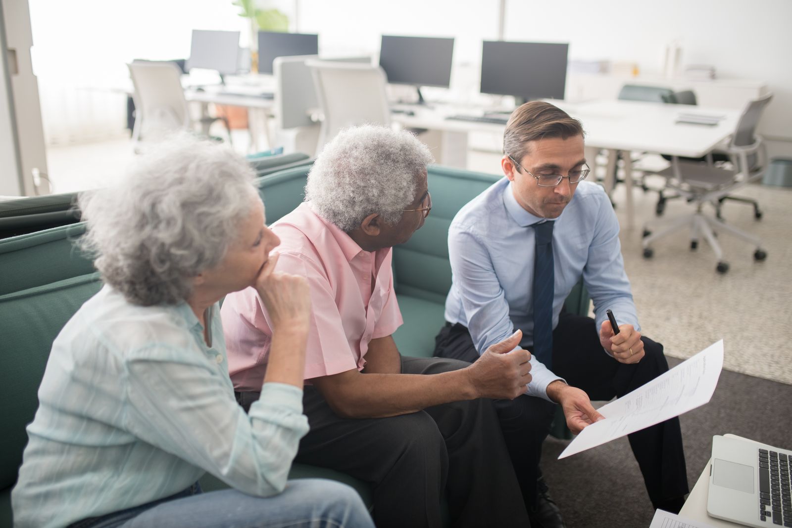 A loan officer walking clients through their options